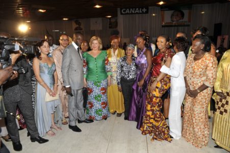 Mrs Dominique Ouattara poses with designers, modelers